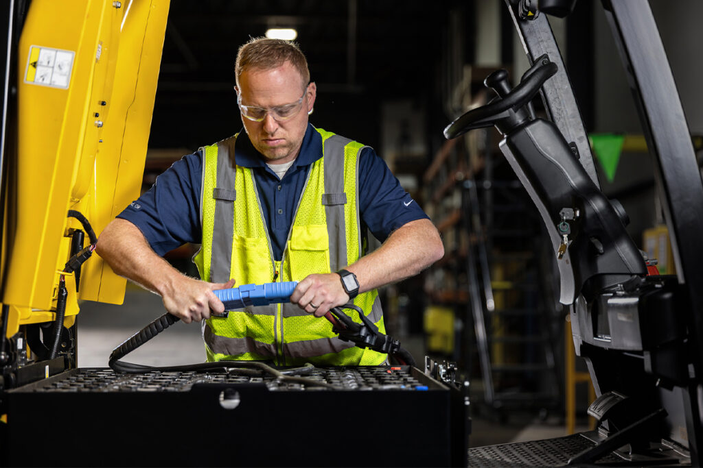 Tech working on a battery